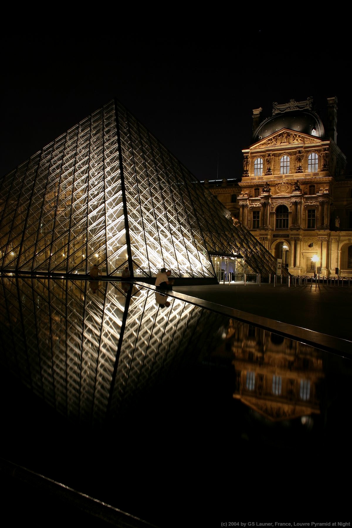 Louvre Pyramid at Night in Louvre Museum, France